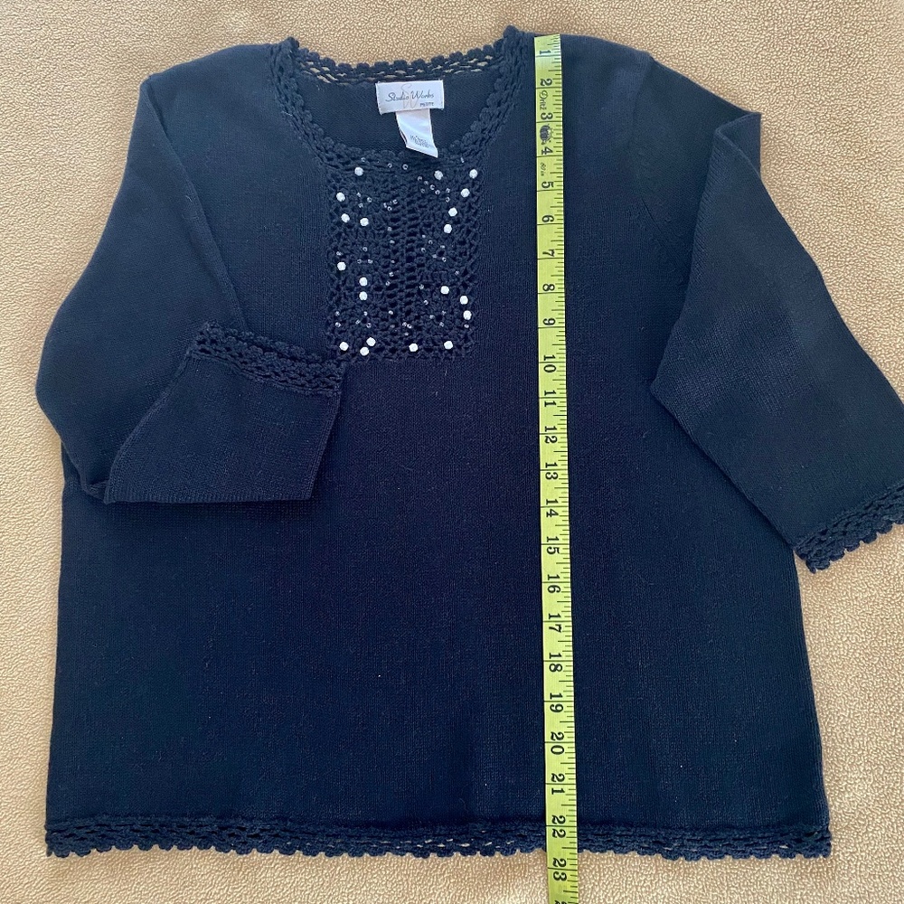 Cute little black sweater with beads and lace trimming